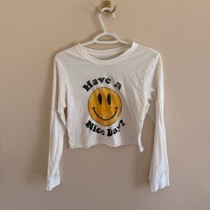 Cropped white long sleeve graphic tee